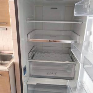 an empty refrigerator with its door open in a kitchen at Carlo e Dani Flat in Venice in Venice