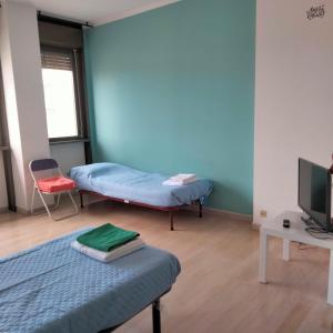 a room with two beds and a tv in it at Carlo e Dani Flat in Venice in Venice