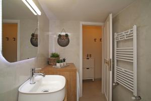 a bathroom with a sink and a mirror at Cozyhome 4 ILISIA in Thessaloniki +23 photos