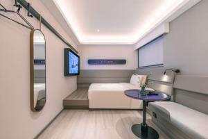 TV a/nebo společenská místnost v ubytování Atour X Hotel Shanghai Pudong Babaiban