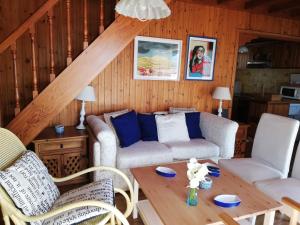 a living room with a couch and a table at Casa de madera sobre el mar in Nigrán
