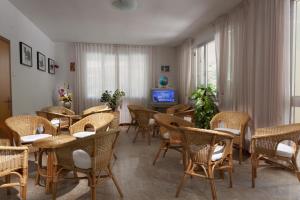 TV a/nebo společenská místnost v ubytování Hotel Gattuccio