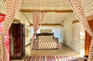 a lego bedroom with a bed in a lego house at Atithi Luxury Resort in Pushkar