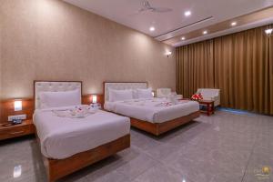 Voodi või voodid majutusasutuse Savitri Resort toas