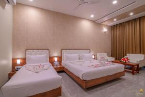Voodi või voodid majutusasutuse Savitri Resort toas
