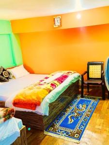 Postel nebo postele na pokoji v ubytování Parvat View Homestay