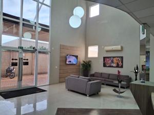 TV a/nebo společenská místnost v ubytování Ônix Inn Hotel Cravinhos