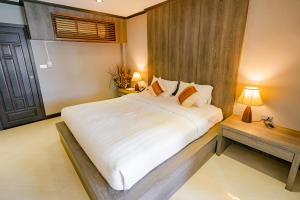 Postel nebo postele na pokoji v ubytování Naiya Buree Boutique Resort