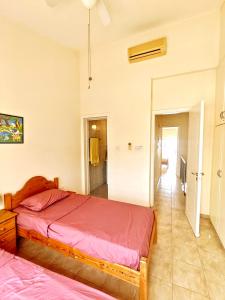a bedroom with a large bed and a hallway at A Heaven on Earth Ενας επιγειος παραδεισος in Peyia +42 photos