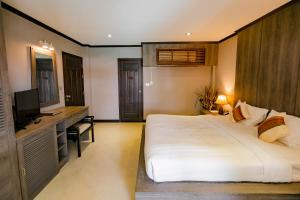 Postel nebo postele na pokoji v ubytování Naiya Buree Boutique Resort