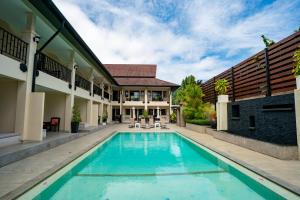 Bazén v ubytování Naiya Buree Boutique Resort nebo v jeho okolí