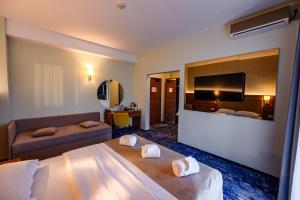 Postel nebo postele na pokoji v ubytování Hotel Ryon