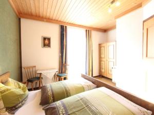 Łóżko lub łóżka w pokoju w obiekcie Spacious Apartment near Ski Area in Mittersill