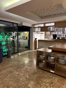 a kitchen with a counter with plates on it at NFK The House Hotel in Antalya