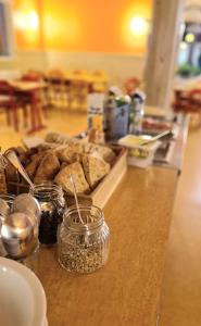 a counter with jars of food and bread on it at Kuttainen Lodge in Karesuando