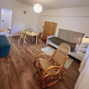 a living room with a couch and a table at Bolgárkert Family House in Budapest