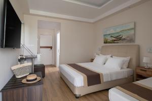 Postel nebo postele na pokoji v ubytování Hotel Rema + 37 fotografií