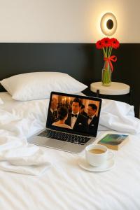Postel nebo postele na pokoji v ubytování Atmosfera Hotel