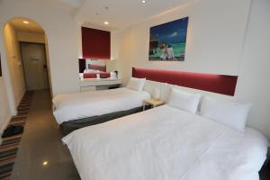Postel nebo postele na pokoji v ubytování Hamdeok Beach Stay Jeju