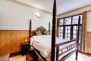 Postel nebo postele na pokoji v ubytování T Cherry Villa by Le Montfort Resort