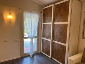 a room with a large window and a curtain at Casa Bianca in Vaiano +33 photos