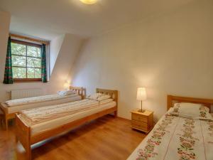 a bedroom with two beds and a window at Apartament Krupówki 73 - 2-7 person in Zakopane
