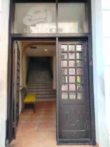 a door to a building with a stairs in the background at OYO Hotel Plaza Veracruz Centro Historico in Veracruz