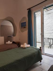 Postel nebo postele na pokoji v ubytování Niki Rooms