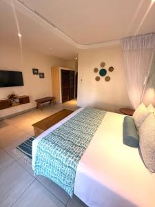 Postel nebo postele na pokoji v ubytování Neptune Paradise Beach Resort & Spa - All Inclusive