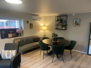 a living room with a table and a couch at Trollstova-Sogndal in Sogndal