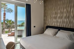 Postel nebo postele na pokoji v ubytování Hotel Nautilus Excelsior - Adults Only
