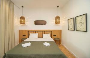 Ένα ή περισσότερα κρεβάτια σε δωμάτιο στο Cozy 1BR Apartment - By Wehost