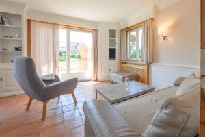 Posezení v ubytování Haus Westsee EG mit Garten