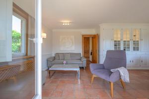 Posezení v ubytování Haus Westsee EG mit Garten