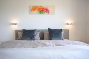 Postel nebo postele na pokoji v ubytování Haus Westsee EG mit Garten