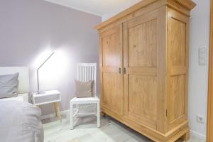 Postel nebo postele na pokoji v ubytování Haus Westsee EG mit Garten