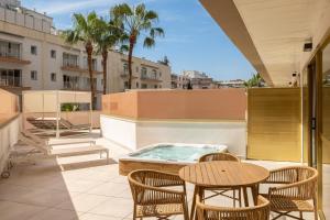 a patio with a hot tub on top of a building at htop Amaika SPA 4Sup - Bliss - Adults Only Plus 18 in Calella