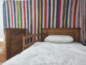 Uma cama ou camas num quarto em HOSTEL bANANA
