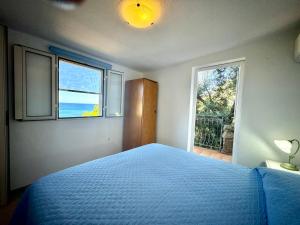 Ένα ή περισσότερα κρεβάτια σε δωμάτιο στο Sea View Joy Collection