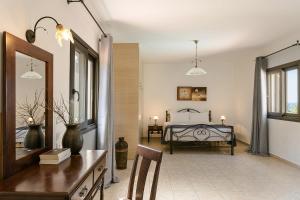 A bed or beds in a room at Villa Helios
