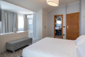 Postel nebo postele na pokoji v ubytování Grand Hotel