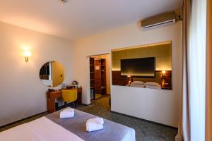 Postel nebo postele na pokoji v ubytování Hotel Ryon + 24 fotografií
