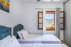 Ένα ή περισσότερα κρεβάτια σε δωμάτιο στο Astraea Holiday Home