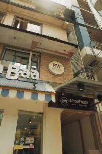 a building with aba sign on the side of it at Brightwood Hotel & Residences in Manila