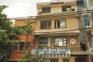a building with a barbara sign on the side of it at Brightwood Hotel & Residences in Manila