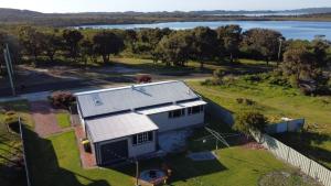 an aerial view of a house with a view of the water at Walpole House in Walpole