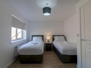 Ένα ή περισσότερα κρεβάτια σε δωμάτιο στο Urban Nest Newcastle - PTK