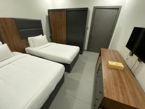 Saray Prime Suites客房内的一张或多张床位