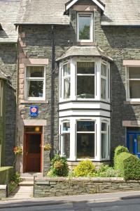 a brick house with a front door at Brookfield B&B Guest House in Keswick