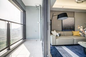 Predel za sedenje v nastanitvi Kingkey Shuibei International Apartment Hotel